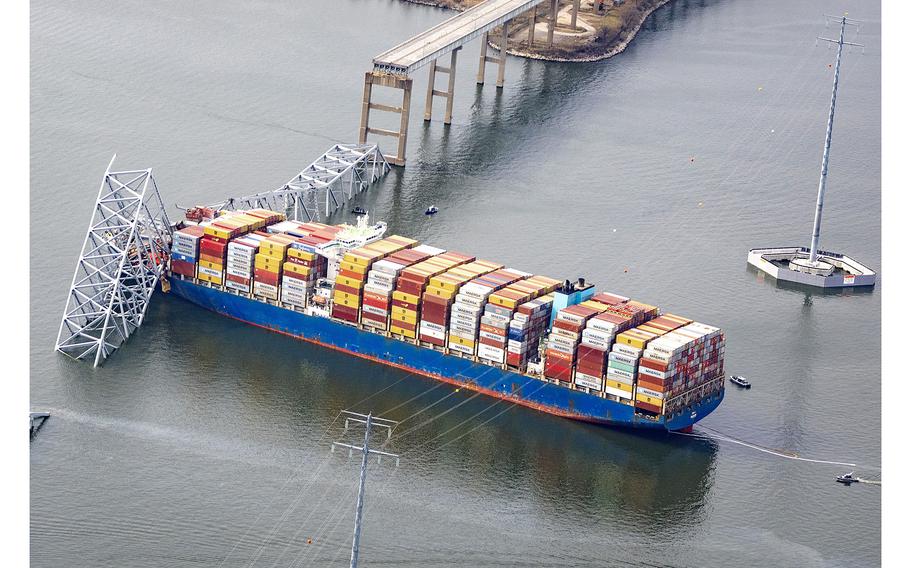 The cargo ship Dali sits in the water after running into and collapsing the Francis Scott Key Bridge on March 26, 2024, in Baltimore.