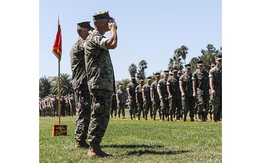 Lt. Gen. George Smith Jr., the outgoing commanding general for I Marine Expeditionary Force, and Maj. Gen. Bradford Gering, the incoming commanding general for I MEF, salute the parade during the I MEF succession of command ceremony on Camp Pendleton, Calif., on Aug. 18, 2023. 