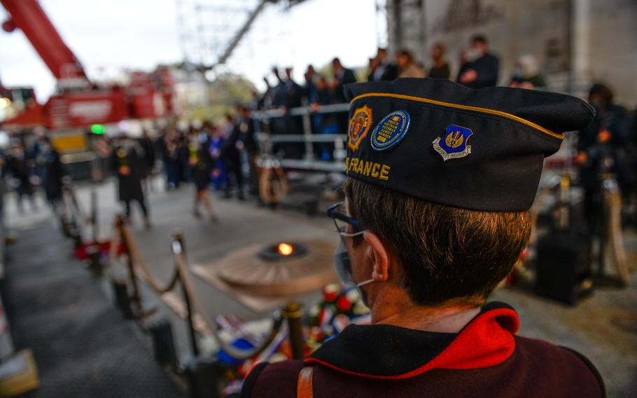 A member of the American Legion in France attends a wreath laying ceremony at the Tomb of the Unknown Soldier underneath the Arc de Triomphe in Paris, Oct. 26, 2021. The event marked a series of events commemorating the 100-year anniversary of the U.S. tomb at Arlington National Cemetery. 