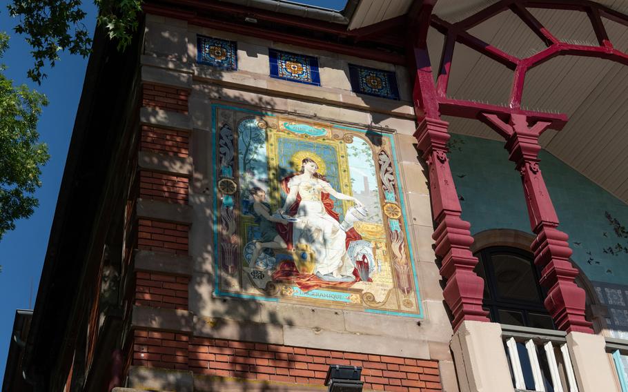 A colorful mural on the wall of a building in Sarreguemines, France.
