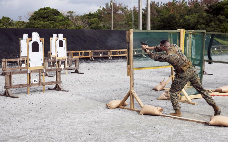 Marine Staff Sgt. John Tetrault takes a shot during the the Far East Marksmanship Competition at Camp Hansen, Okinawa, Dec. 13, 2022. 