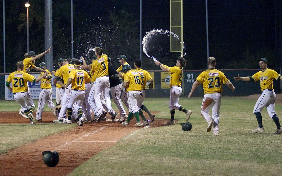The Mainz Athletics celebrate after walking off against Guggenberger Legionaere Regensburg during a 4-3 extra-inning win on June 16, 2023, in Mainz, Germany. The two-time German champion Athletics marked their 1,000th Baseball Bundesliga game earlier this season.