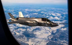 A British air force F-35B Lightning receives fuel from a tanker aircraft over Alaska in May 2023. Prime Minister Keir Starmer said Wednesday that the U.K. is going to purchase 12 F-35As, which can be equipped with nuclear bombs, and join NATO's nuclear mission.