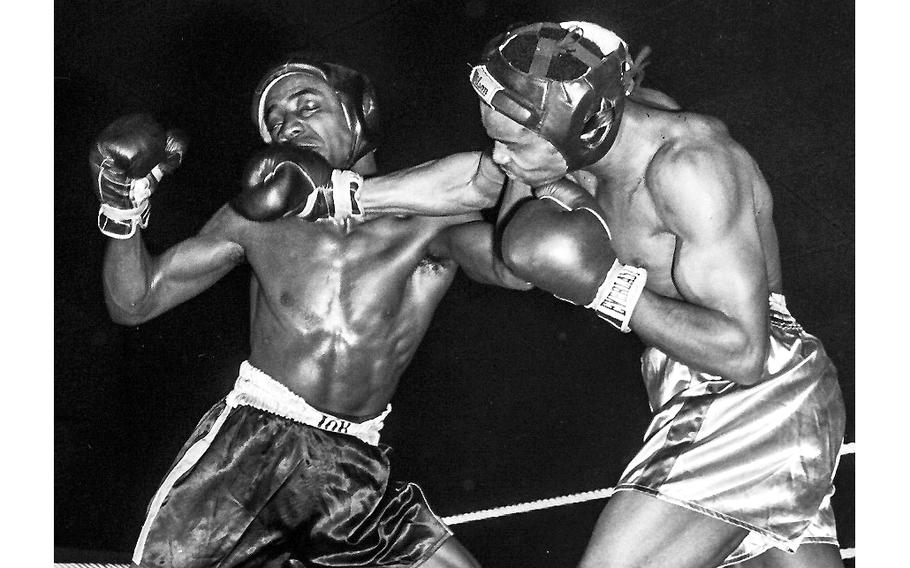Hanau, West Germany, March, 1957: A fighter connects with a right during the opening round of the U.S. Army Europe northern regional boxing championships at the Pioneer Kaserne gym.