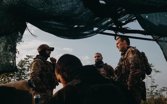 Soldiers from a drone unit of the 47th Brigade stand outside a forward bunker position on the southern front line near Orikhiv, Ukraine, on Sept. 14. MUST CREDIT: Photo for The Washington Post by Wojciech Grzedzinski