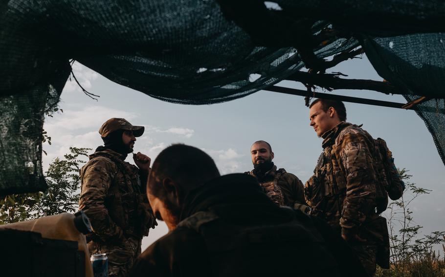 Soldiers from a drone unit of the 47th Brigade stand outside a forward bunker position on the southern front line near Orikhiv, Ukraine, on Sept. 14, 2023.