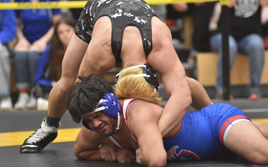 Ramstein’s Matthew Rutlege doesn’t appear to like Stuttgart’s Jack Gruver’s head to his back Friday, Feb. 9, 2024, at the DODEA European Wrestling Championships in Wiesbaden, Germany. Gruver won the match.