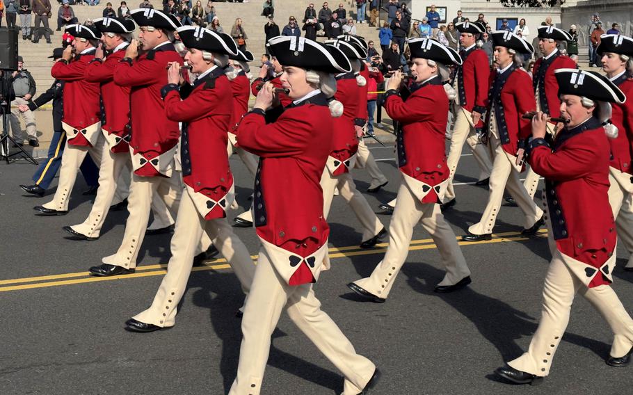 The U.S. Army’s Old Guard Fife and Drum Corps marches in the National Veterans Day Parade on Sunday in Washington. 