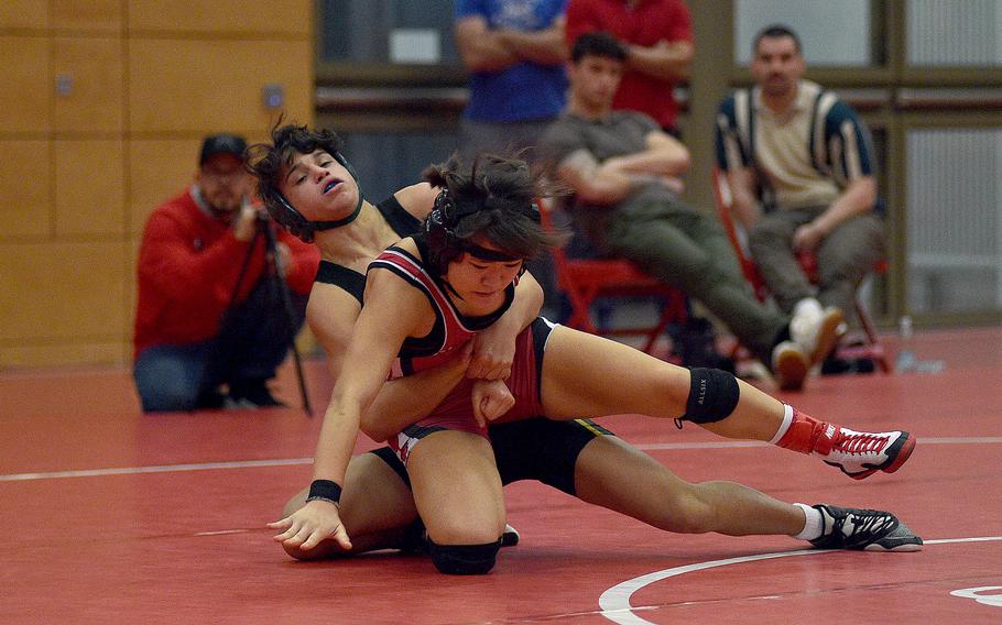 Alconbury's Edison Vega swings Raider Uno Tate during a 113-pound match at a wrestling meet on Dec. 9, 2023, at Kaiserslautern High School in Kaiserslautern, Germany.