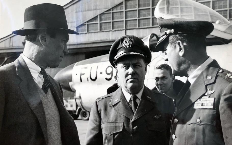 Yokota commander Col. Fred Stevers, center, chats with movie star Jimmy Stewart, left, and Maj. Gen. Kenneth McNaughton at the air base in western Tokyo, in 1955.