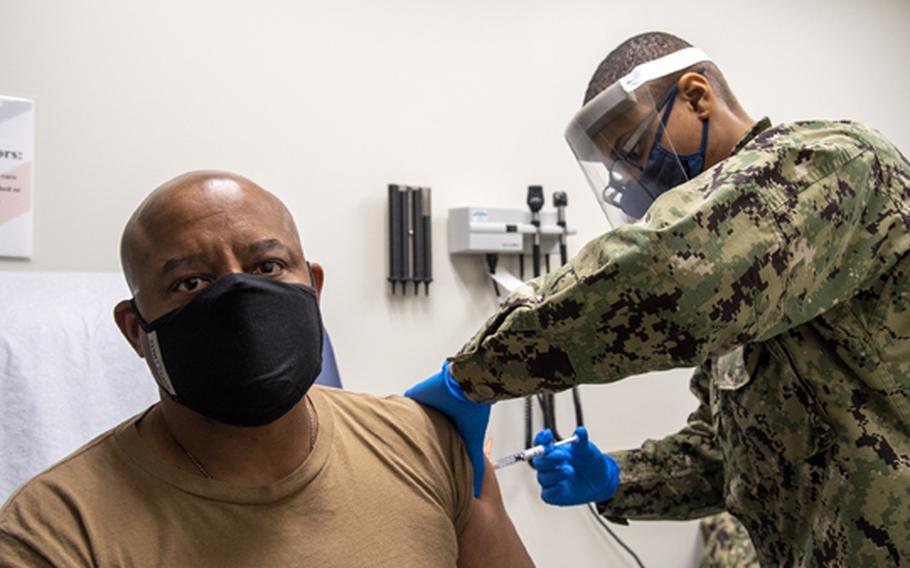 Capt. Michael Riley, Naval Service Training Command chief of staff, receives the COVID-19 vaccine at the Naval Station Great Lakes Zachary and Elizabeth Fisher Medical/Dental Clinic on Jan. 28, 2021.