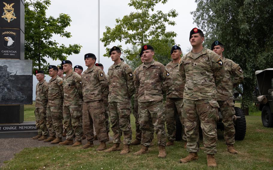 Soldiers stand in formation.