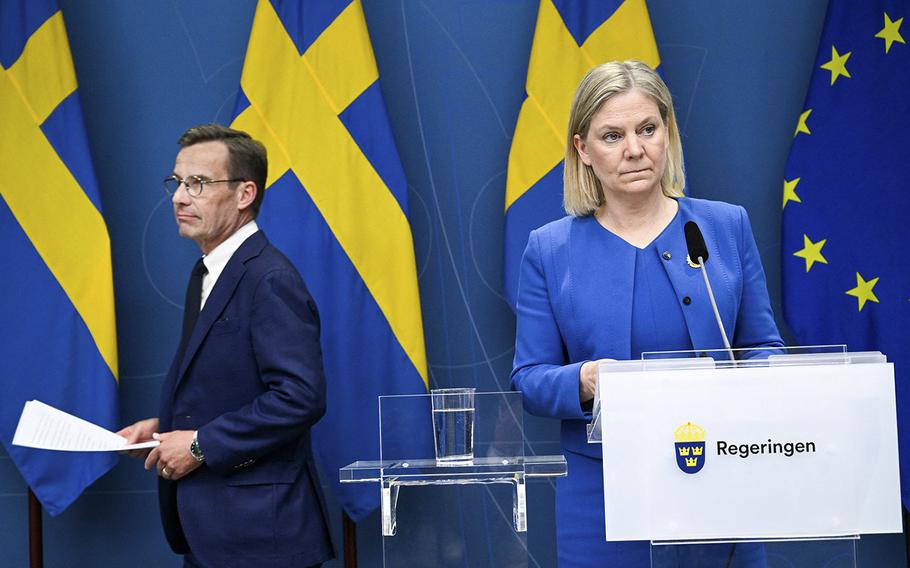 Sweden’s Prime Minister Magdalena Andersson, right, and the Moderate Party’s leader Ulf Kristersson arrive for a briefing in Stockholm on May 16, 2022. 