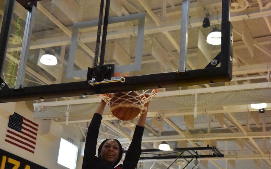 Kaiserslautern’s Hazel Sanders slam the ball in during the dunk competition that was part of the DODEA-Europe Girls All-Star Basketball Game on Saturday, Feb. 24, 2024, in Vicenza, Italy.