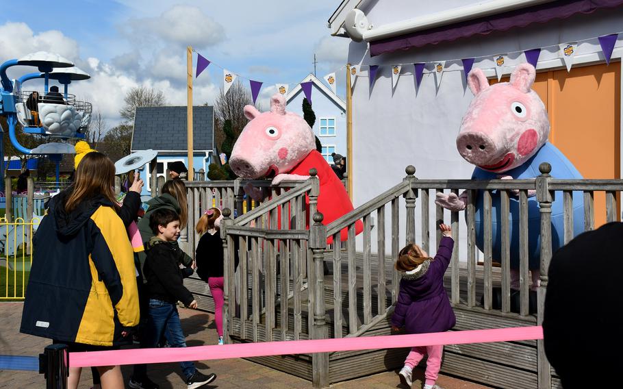 Families wait in line to meet Peppa Pig and her brother George at Peppa Pig World in Romsey, England, April 2, 2022. The park has many interactive events throughout the day for the visiting patrons to participate in. 