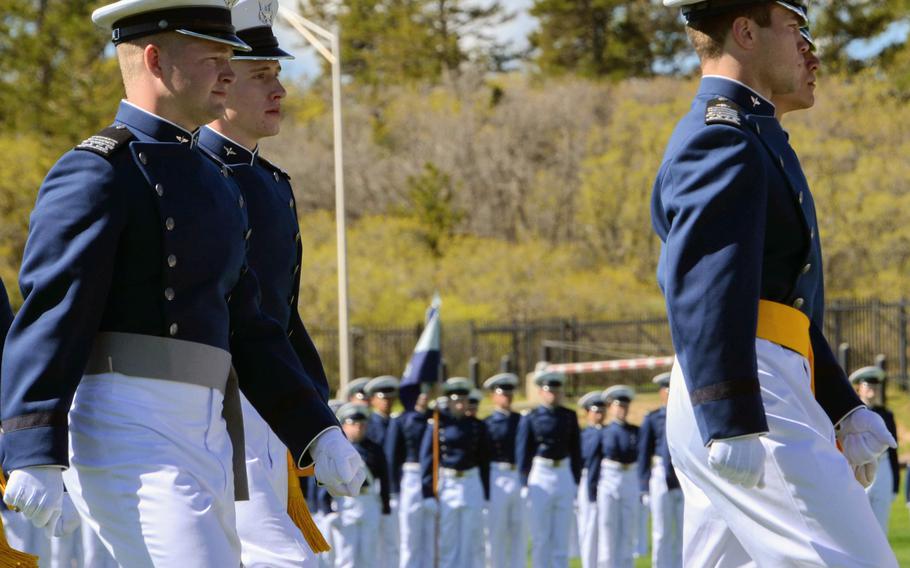 Air Force Academy Cadet 1st Class Tanner Johnson, left, marches with Cadet Squadron 14 in the graduation parade at the Colorado Springs, Colo., service academy, May 25, 2021. Johnson was commissioned that day into the U.S. Space Force, becoming the first person diagnosed with Type 1 diabetes to be allowed to serve in the U.S. military.