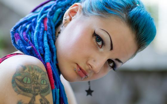 Tattoos, piercings and unnatural hair color is just the next generation’s way of keeping up appearances. (Note: This photo is not of a Molinari offspring.)