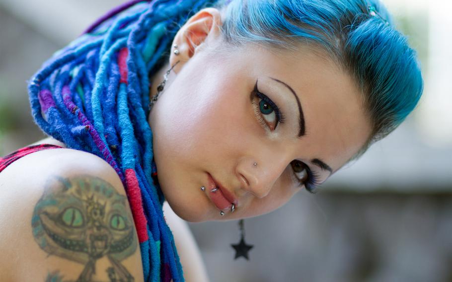 Tattoos, piercings and unnatural hair color is just the next generation's way of keeping up appearances. (Note: This photo is not of a Molinari offspring.)