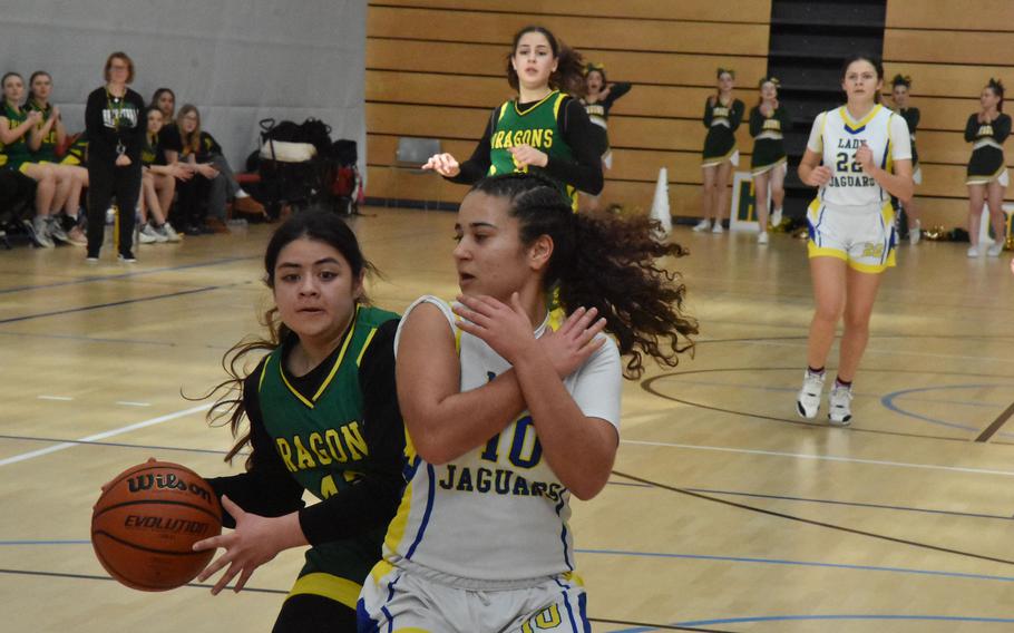Alconbury’s Kalilia Te’o tries to get past Sigonella’s Charlize Caro on Thursday, Feb. 15, 2024, at the DODEA European Division III Basketball Championships in Wiesbaden, Germany.