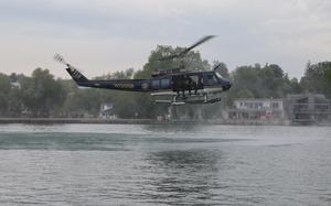 A helicopter over a river.