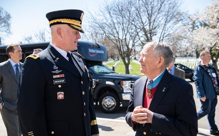 National Capital Region and U.S. Army Military District of Washington Commanding General Maj. Gen. Trevor J. Bredenkamp speaks with a Medal of Honor recipient outside of the Memorial Amphitheater at Arlington National Cemetery, Arlington, Va., Monday, March 25, 2024. The recipients were at ANC for an annual reflection ceremony for National Medal of Honor Day. The ceremony included an Army Full Honors Wreath-Laying Ceremony at the Tomb of the Unknown Soldier conducted by Medal of Honor recipients.