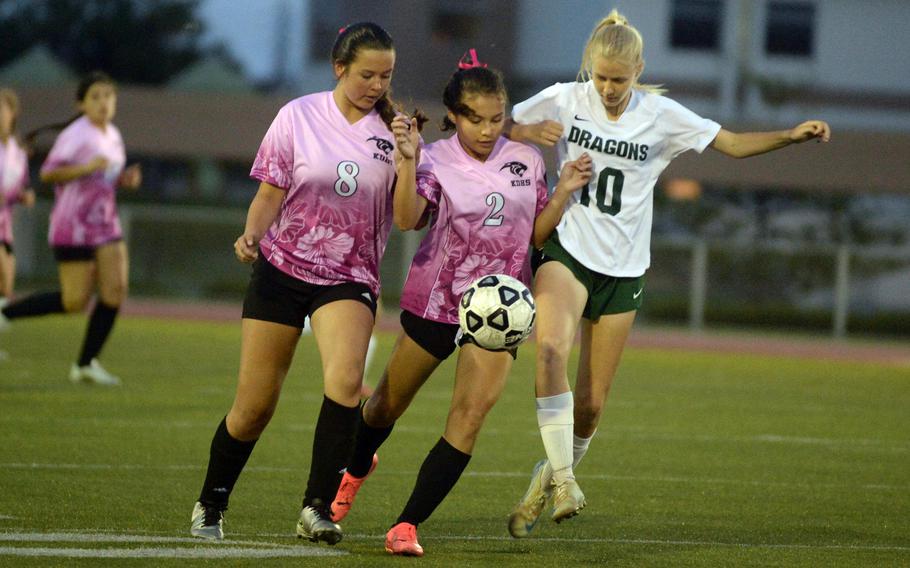 Hailey Stoudemayer fights for the ball.