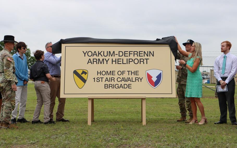 The families of Chief Warrant Officer 4 Keith Yoakum and Chief Warrant Officer 2 Jason DeFrenn on May 4, 2023, unveil the new sign at the airfield at Fort Cavazos, Texas, in honor of the two pilots who died in Iraq. The Yoakum-DeFrenn Army Heliport was called Hood Army Airfield in honor of John Bell Hood, a Confederate general. 