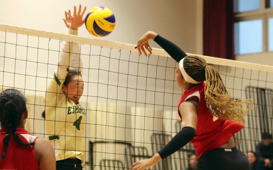 Nile C. Kinnick's Ja'lilah Brice spikes against Robert D. Edgren's Milan Bean during Saturday's DODEA-Japan volleyball match. The Red Devils won in three sets.