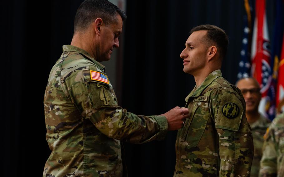 Sgt. Maj. of the Army Michael Weimer meets the service's newest recruiters during a ceremony Dec. 21, 2023, at Fort Knox, Ky. Weimer signed a memo this week explaining policy changes to professional military education, while announcing the end of temporary noncommissioned officer promotions.