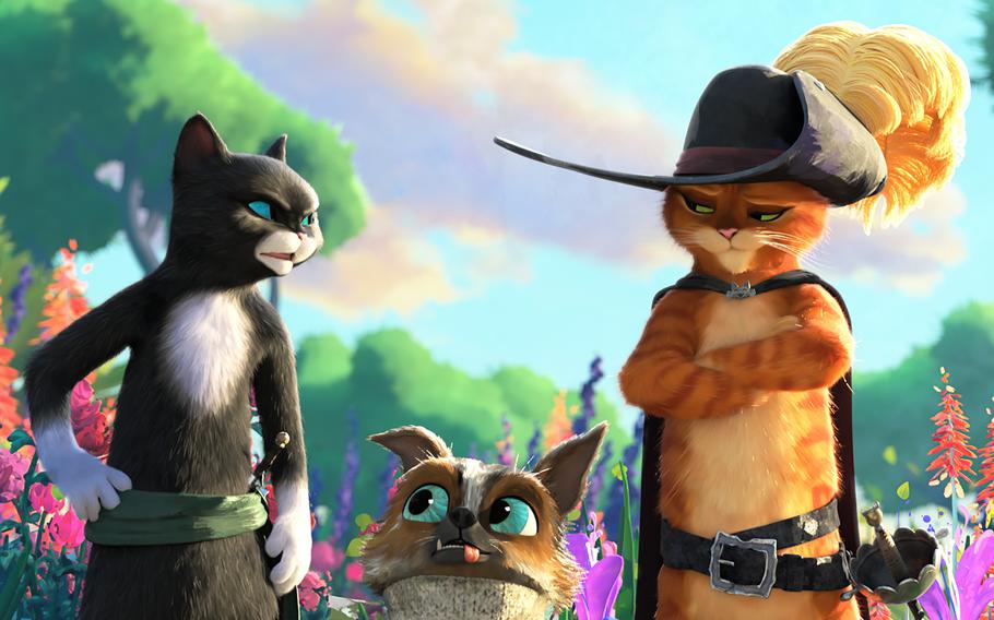 From left, Kitty Softpaws (Salma Hayek), Perro (Harvey Guillén) and Puss in Boots (Antonio Banderas) in “Puss in Boots: The Last Wish.” 