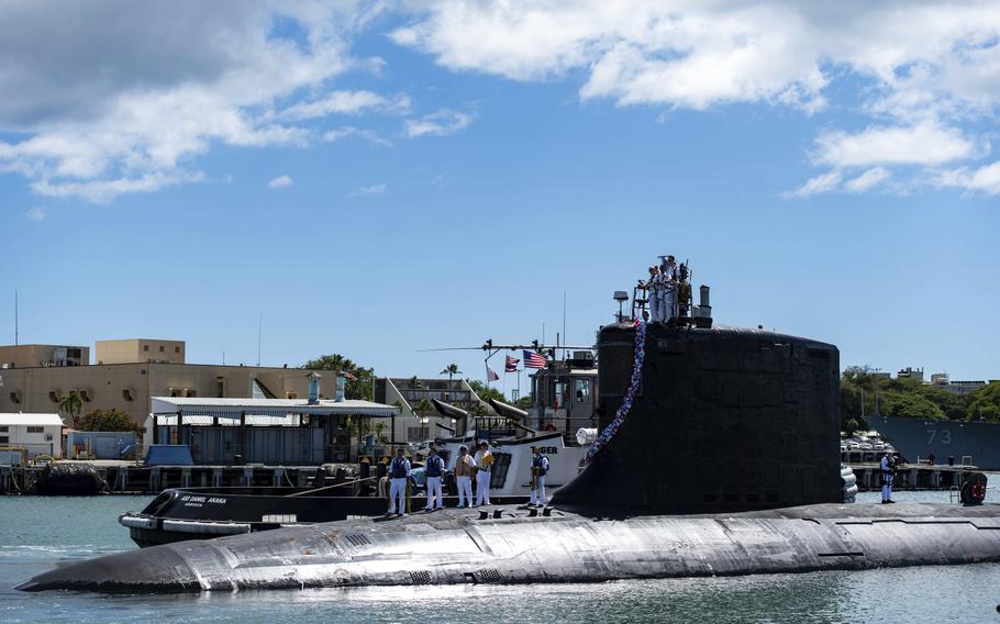In this photo provided by U.S. Navy, the Virginia-class fast-attack submarine USS Illinois returns to Joint Base Pearl Harbor-Hickam from a deployment in the 7th Fleet area of responsibility on Sept. 13, 2021. 