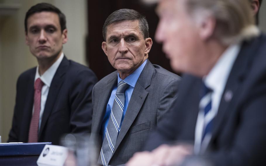 Michael Flynn, center, attends a meeting with President Donald Trump in January 2017. 