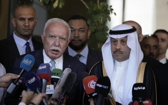 Nayef al-Sudairi, Saudi Arabia's the first-ever Saudi ambassador to the Palestinian Authority, right, and Palestinian Minister of Foreign Affairs and Expatriates, Dr. Riyad Al-Maliki, left, make a joint statement after their meeting in Ramallah, Tuesday, Sept. 26, 2023. Al-Sudairi visited the Palestinian territories Tuesday to discuss the burgeoning Saudi-Israeli normalization deal, which the kingdom has said will hinge on what concessions Israel is willing to grant the Palestinians. (AP Photo/Majdi Mohammed)