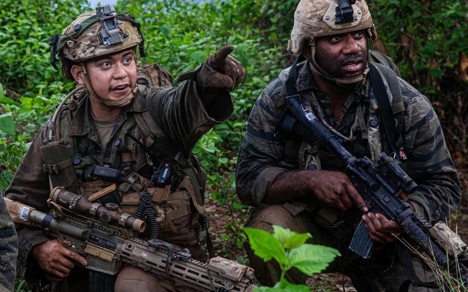 U.S. Army sniper Sgt. Ratu Komaisavai directs Army Spc. Lavarias Kawika, both assigned to the 100th Infantry Battalion and roleplaying as opposing forces during an engagement as part of the Joint Pacific Multinational Readiness Center-Exportable exercise at Fort Magsaysay, Philippines, June 7, 2024. 