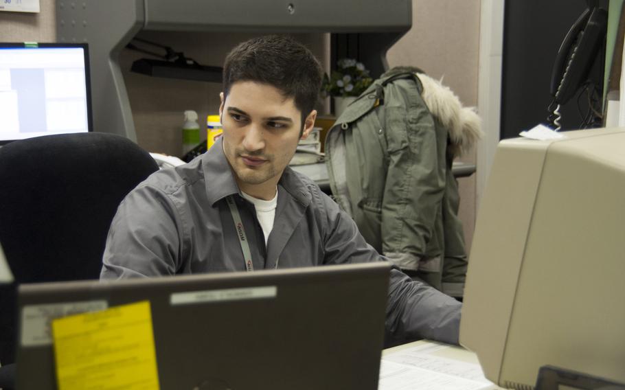 Alex Belfiore, 24, Fulton, N.Y., one of about 24 Harris Corporation contractors on site at Thule’s Detachment 1, tracks polar-orbiting satellites. 