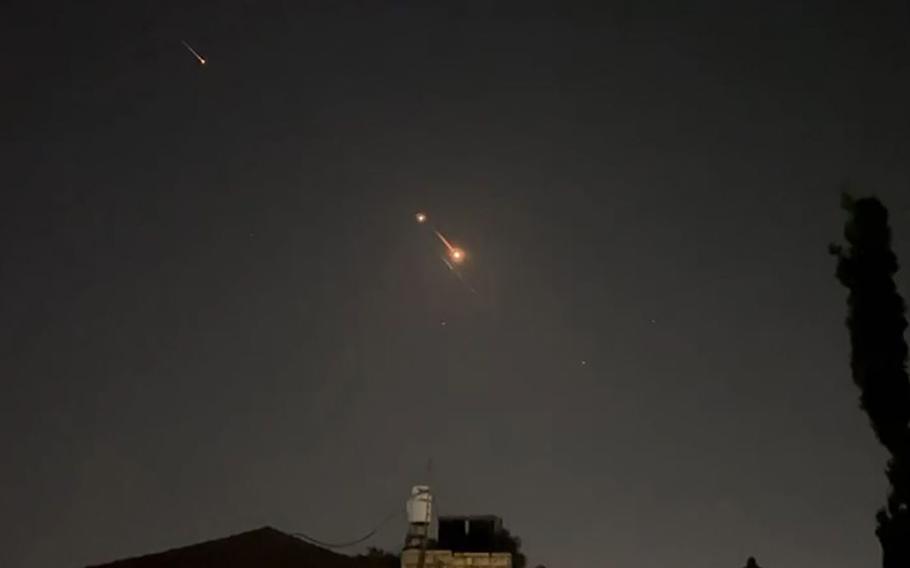 This video grab from AFPTV taken on April 14, 2024, shows explosions lighting up the Jerusalem sky during Iranian attack on Israel. 