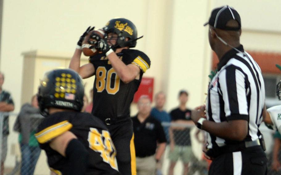 Kadena's Erik Puterbaugh intercepts a pass that he'll return 18 yards for a touchdown.