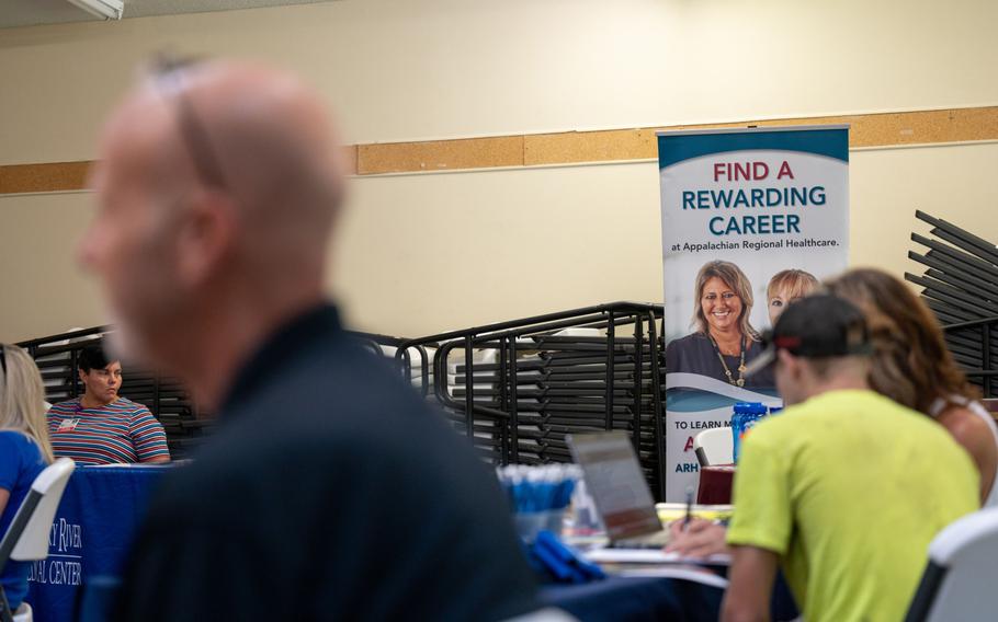 Appalachian Regional Healthcare signage seeking job applications during a job fair at a community center in Beattyville, Ky., on July 28, 2021.