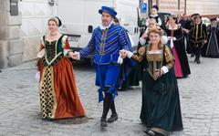 People dressed in historical costumes walk down Cesky Krumlov’s medieval streets during the annual Five-Petalled Rose Celebration in the Czech Republic.
