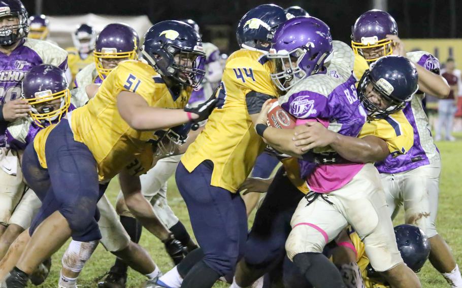 Guam High's interior line, led by senior Avery Gamboa, left, averages 6-foot-2 and 234 pounds.