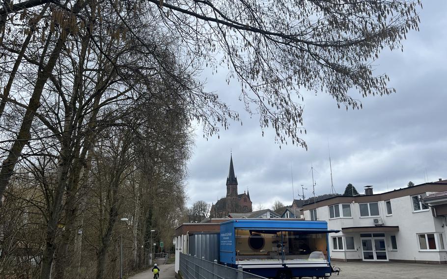 A bike path with a church in the background.