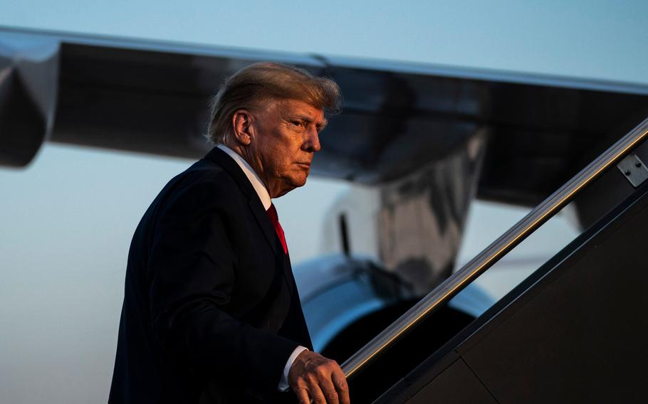 Former president Donald Trump boards his plane after speaking at a campaign event last month at the Manchester-Boston Regional Airport in Manchester, N.H.