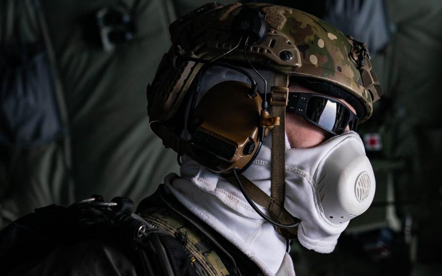 Navy SEALs prepare to jump from an MC-130J transport plane near Kodiak, Alaska, on Feb. 25, 2024.