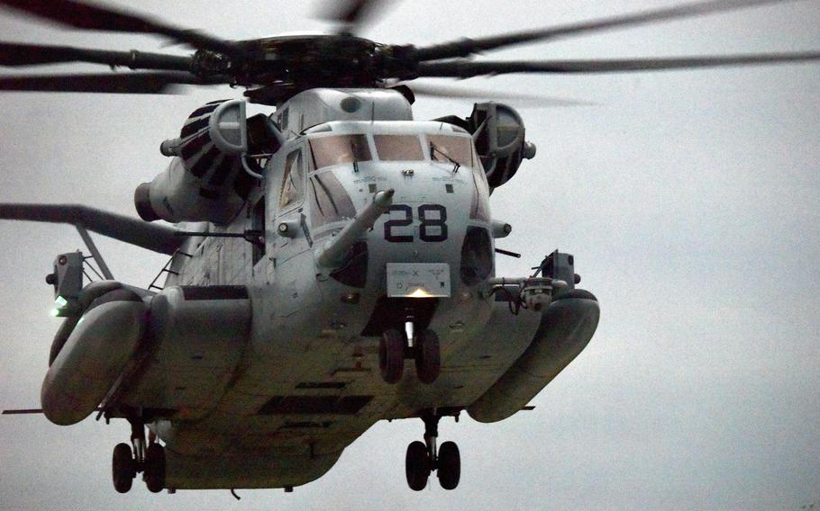 Marines from Alpha Company, 1st Battalion, 2nd Marine Regiment out of Camp Lejeune, N.C., fly in a CH-53E Super Stallion during an exercise at the Central Training Area on Okinawa, Dec. 7, 2022.