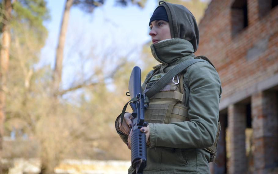 Alla Golumbiivska, a member of the Ukrainian Territorial Defense Forces, prepares for training on how to clear potentially dangerous rooms as part of instruction provided by U.S. military veterans at a location outside Kyiv, Ukraine, on Nov. 2, 2022. 