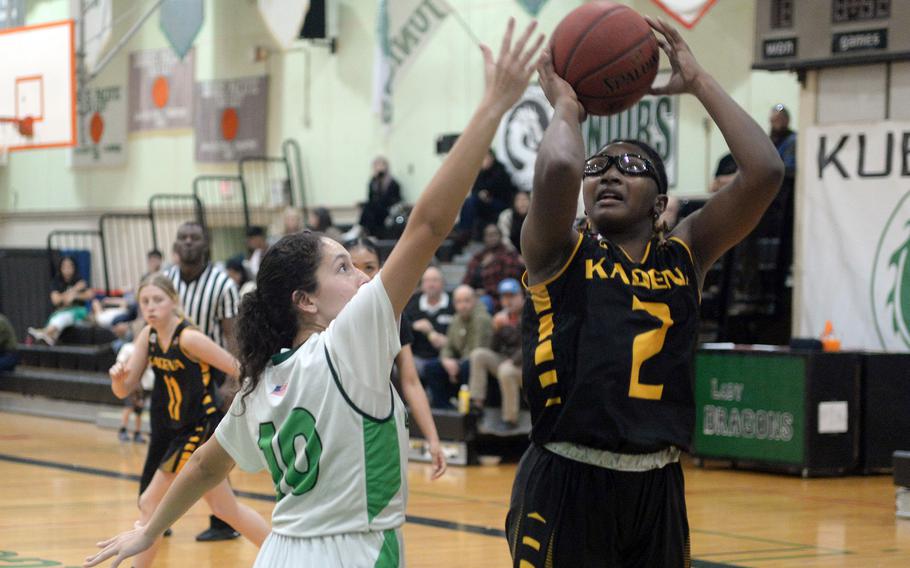 Kadena's Destiny Richardson shoots against Kubasaki's Sophia Grubbs during Thursday's Okinawa girls basketball game. The Panthers won 43-29.