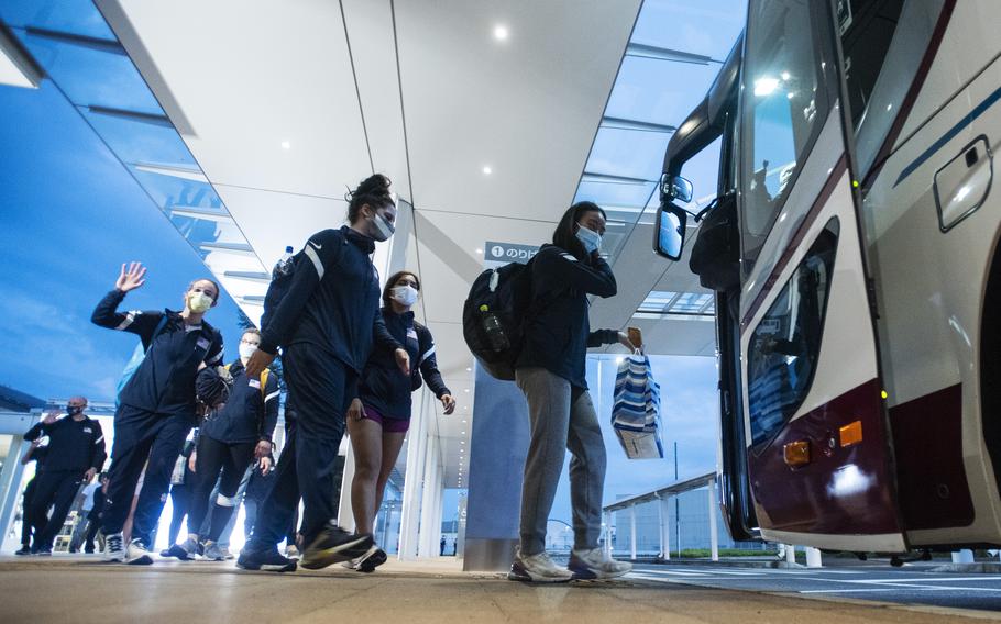 Members of the U.S. women’s Olympic fencing team load onto a bus heading to Marine Corps Air Station Iwakuni, Japan, Tuesday, July 13, 2021.