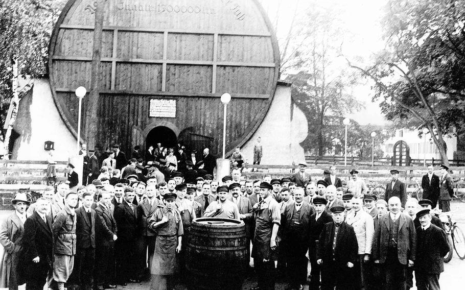 An archive photo shows builders and locals after completion of the restaurant Duerkheimer Fass in Bad Dürkheim, Germany, in 1934. Placed next to fairgrounds, the giant wine barrel restaurant has been a tourist site since it opened. 