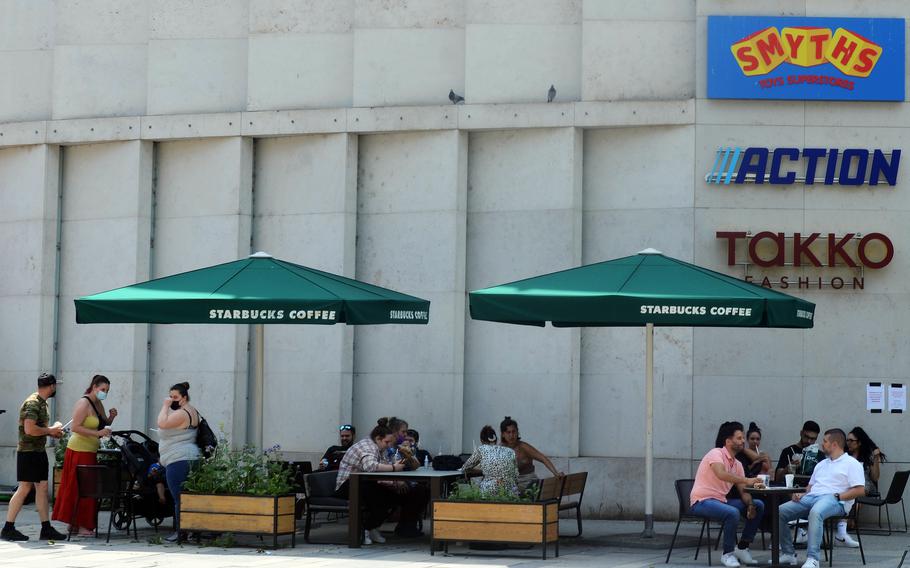 The outside seating at a Starbucks in Wiesbaden, Germany, is packed on June 10, 2021. Coronavirus restrictions on shopping, indoor dining, sporting events and other facets of daily life continue to ease in the city, which is home to U.S. Army Europe and Africa headquarters. 

David Edge/Stars and Stripes 