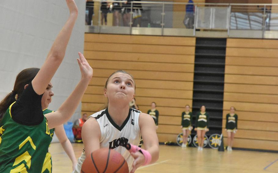 Emergy Koger scoops up a shot.